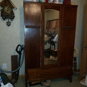 A chifferobe with a mirror.