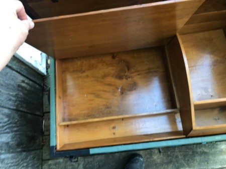 The inside of a steamer trunk.