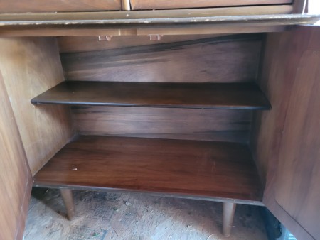 The shelves inside a china cabinet.
