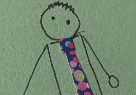 Placing the tie knot on the man.