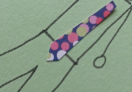 Cutting a point on the tie.