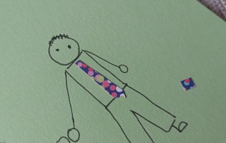 Adding a tie to the man.