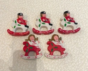 Five Christmas ornaments.