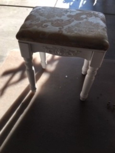 The stool with a broken leg.
