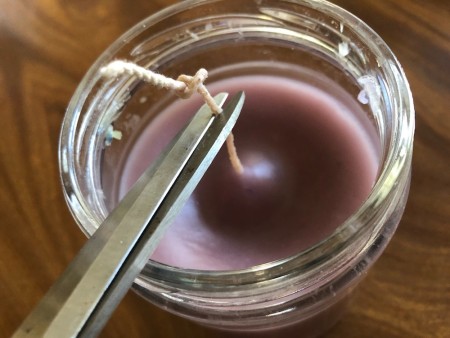 Cutting the wick short.