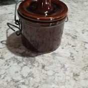 An old brown cheese crock.