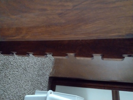 The bottom edge of a game table.