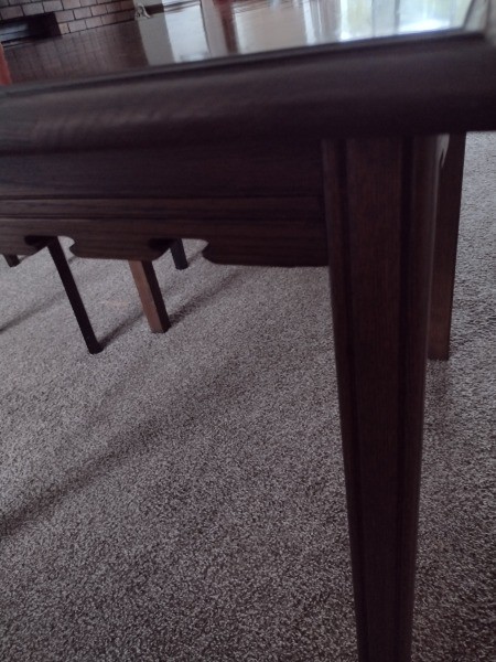 The side and legs of a game table.