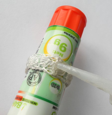 Gluing the crocheted ring.