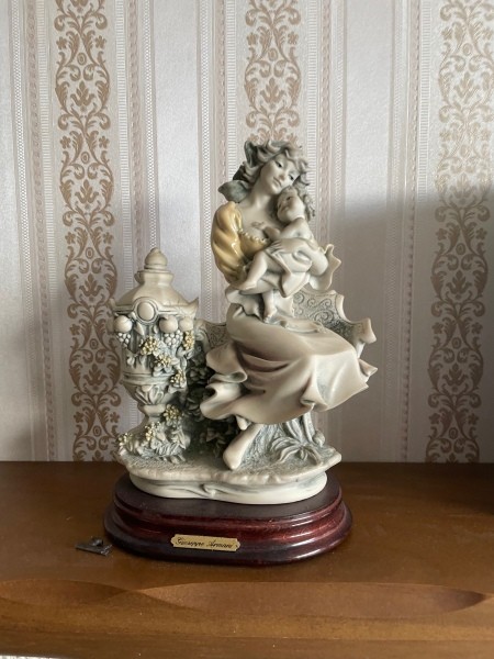 A figurine of a mother and child.