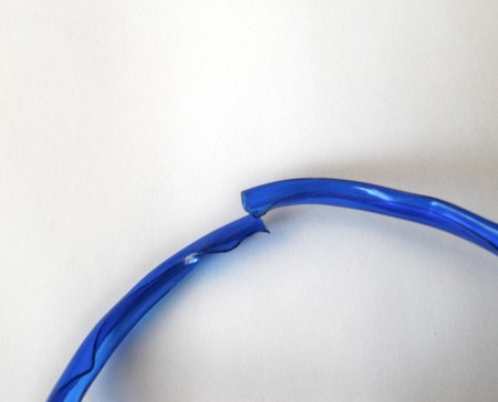 Cutting the bangle to make it smaller.