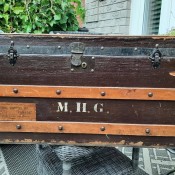 An old trunk with M.H.G. on the front.