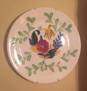 A hand painted decorative plate.