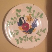 A hand painted decorative plate.