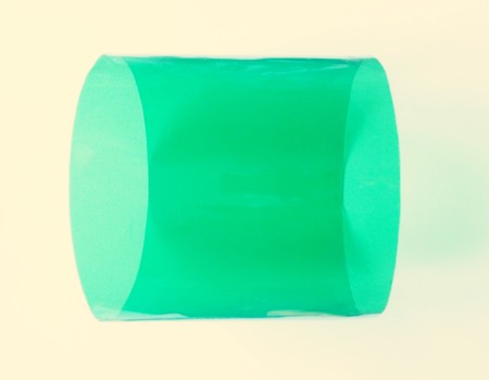 A cylinder of recycled green plastic.