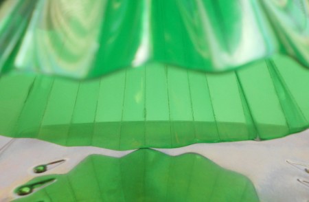 Melting the folded plastic edges.