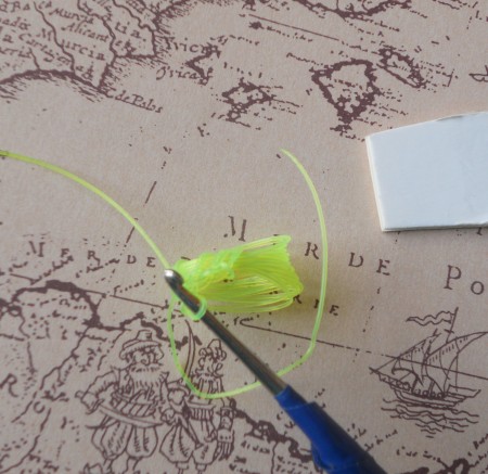 Crocheting the button from fishing line.