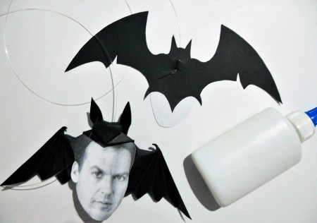 Gluing the photos to the bats.