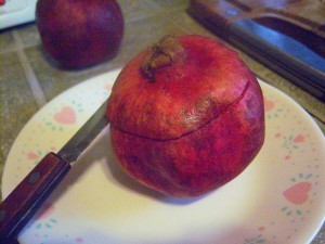 Cutting open a pomegranate.