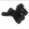 A black stuffed horse with blue eyes.