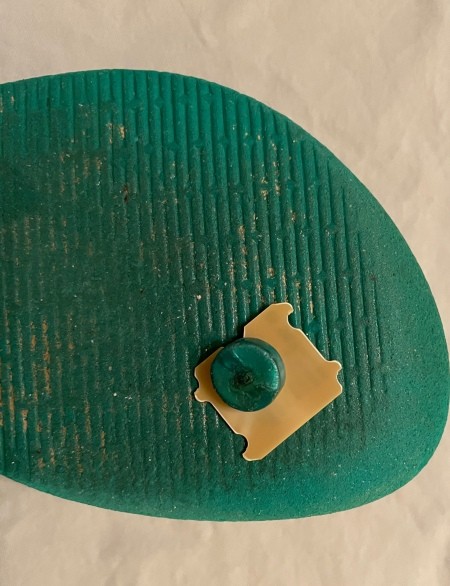 Using a bread tag to fix a flip flop.