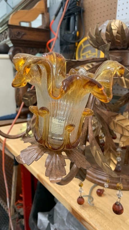 An old glass and metal chandelier.