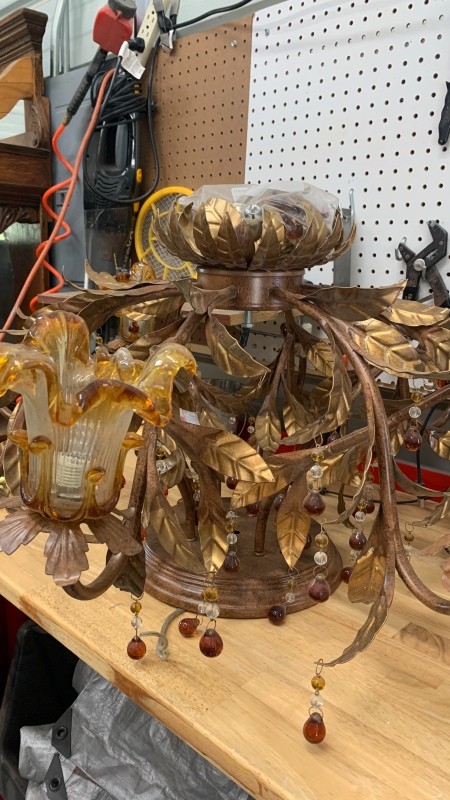 An old glass and metal chandelier.