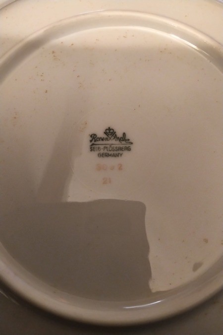 The maker's mark on the bottom of a china plate.