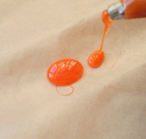 The orange colored hot glue.