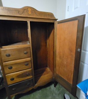 A tall cabinet with the doors open.