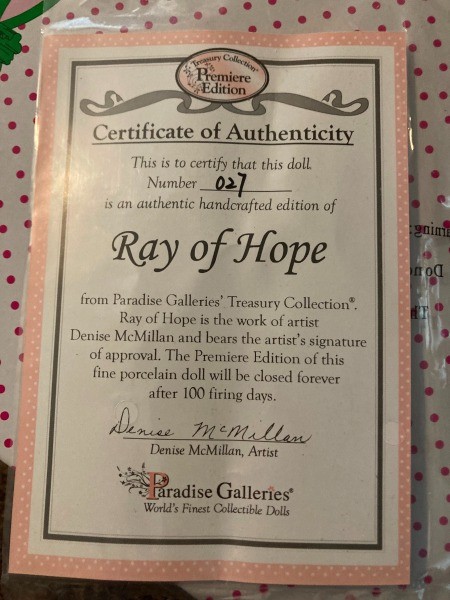 The certificate of authentication for a porcelain doll.