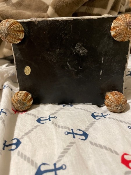 The bottom of a monkey figurine.