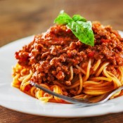 A plate of spaghetti with meat sauce.