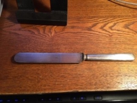 A vintage silver butter knife.