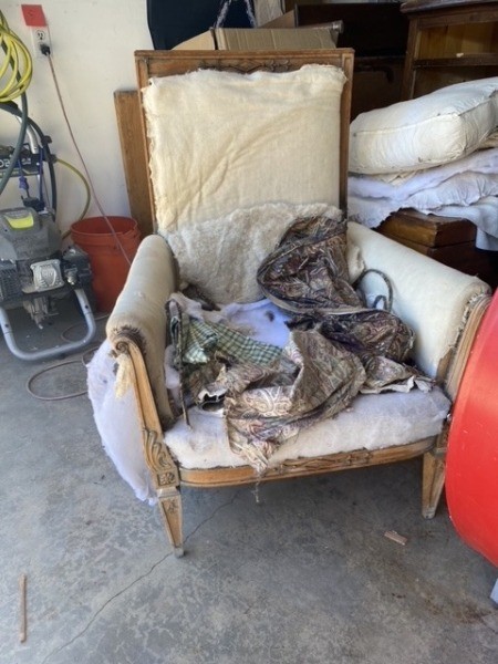 A stuffed armchair without upholstery.