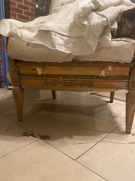 A stuffed armchair without upholstery.