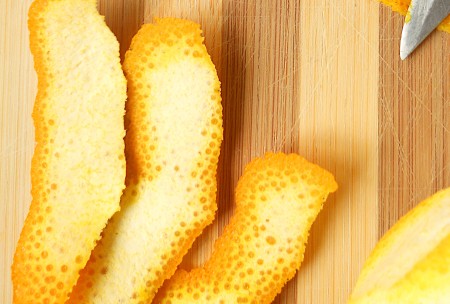 Cutting up the orange peel.