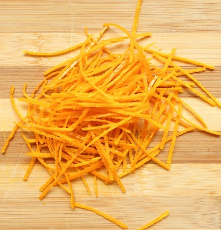 Cutting up the orange peel.