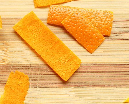 Cutting up the orange peel.