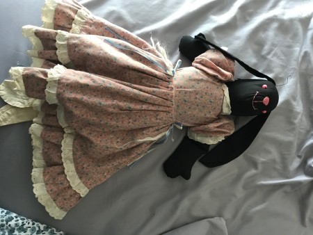 A black bunny with a pink dress.