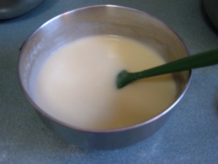 Adding the wet to the dry ingredients.