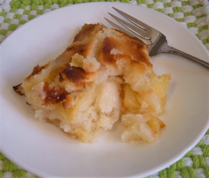 A piece of apple cobbler on a plate.