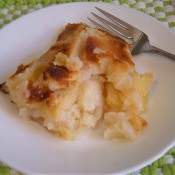 A piece of apple cobbler on a plate.