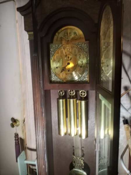 A wooden grandfather clock.