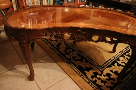 The carved edge of a coffee table.