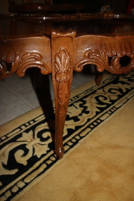 The carved leg of a coffee table.
