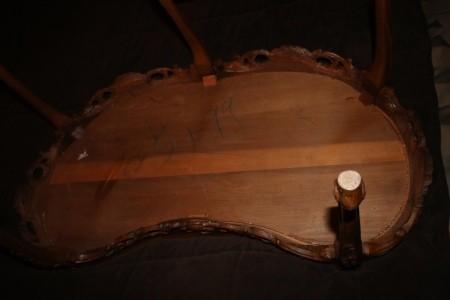 The bottom of a wooden coffee table.