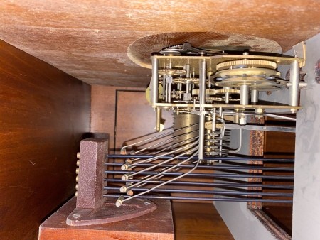 The inside workings of a grandfather clock.