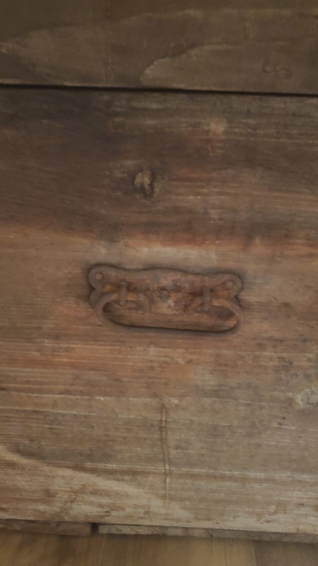 The hardware on a wooden chest.