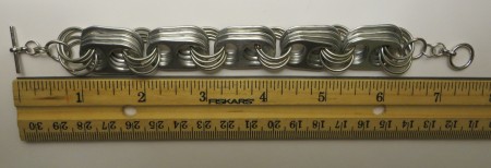 Measuring the completed bracelet.